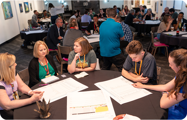 Picture of 4 poeple posing for a picture at the Proctorio user conference.